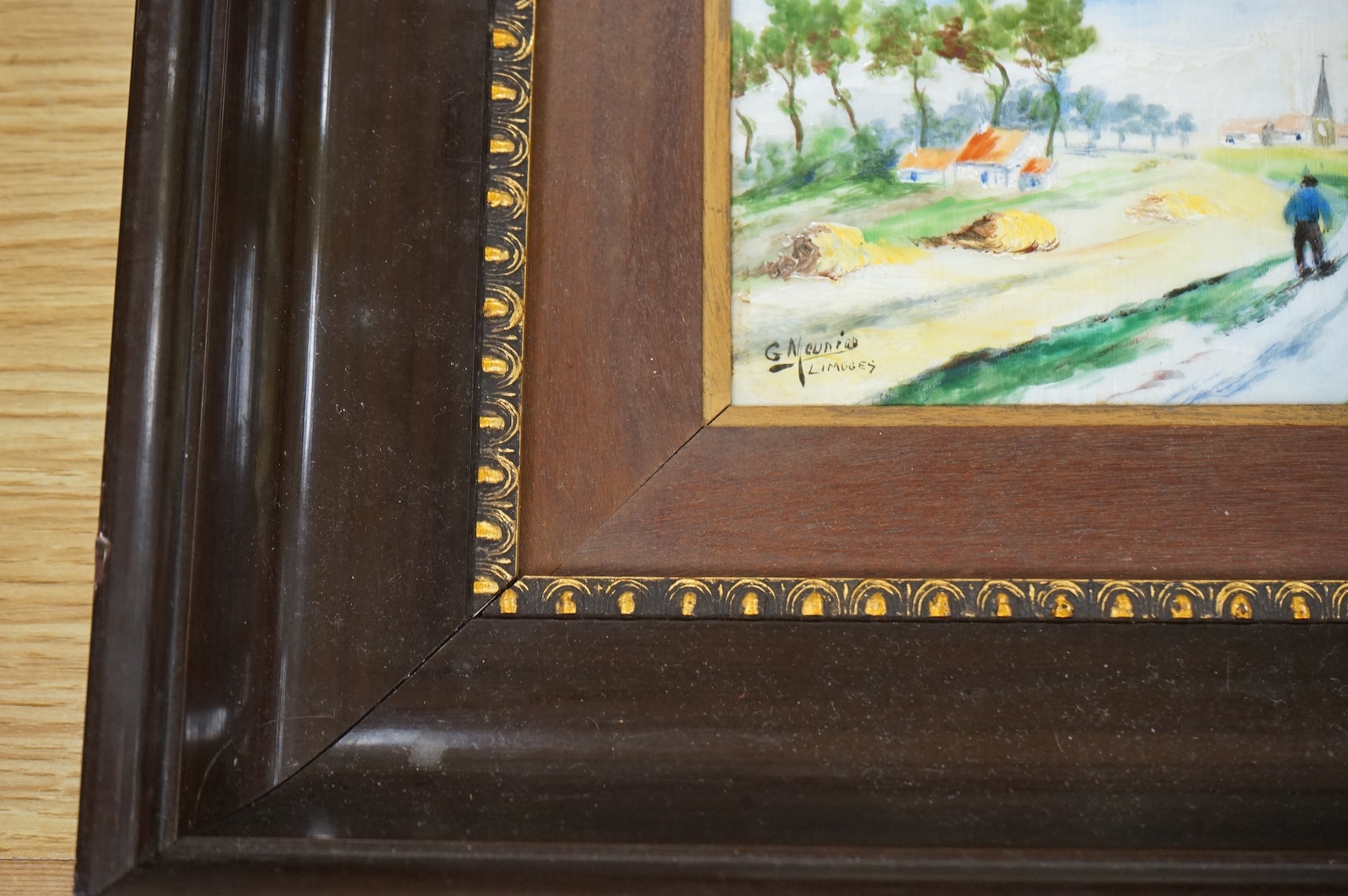 A pair of Limoges porcelain plaques depicting landscapes, signed G Meunier, framed, 30 x 35cm